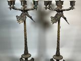 pair of antique brass candelabs with birds on them