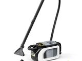 a black and white vacuum cleaner with a yellow cleaning cloth