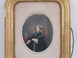 an old picture of a woman in a black dress holding a red chair