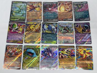 a bunch of pokemon cards sitting on top of a table