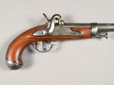 an old gun that is on display on a table
