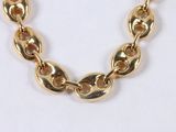 gold plated chain necklace with oval links on a white background