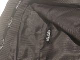 a close up of a jacket with a zipper on it