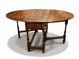 a wooden table with a drawer underneath it on a white surface