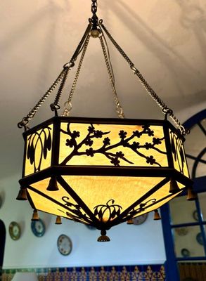 a chandelier hanging from the ceiling in a room