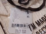 a bag with a label on it sitting on a table
