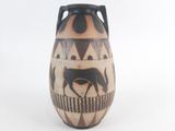 a black and white vase with a picture of a horse on it