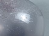 a close up of a silver vase on a table