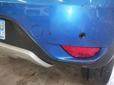 a close up of a car ' s rear bumper with a sticker on it