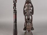 paire de figurines africaines sculptées représentant une femme et un homme