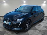 une voiture noire garée sur le sol en damier d'un garage