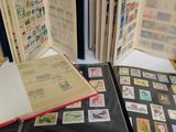 several different types of stamps are in a folder on a table