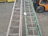 a picture of a forklift with a ladder attached to it