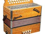 une image représentant un gros plan d'un instrument de musique sur fond blanc