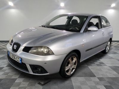 a picture of a silver car on a checkered floor