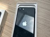 a box with an apple phone sitting on a table