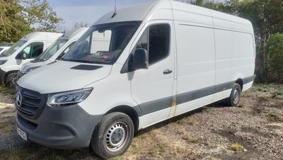 a white van that is parked in a lot