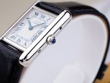 a close up of a wrist watch with a black strap