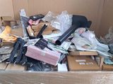a cardboard box full of assorted items in a room
