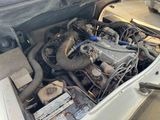a car engine that is sitting in the trunk of a car