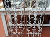 pair of antique wrought iron doors with decorative designs