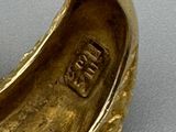 an image of a gold ring with a diamond in the center