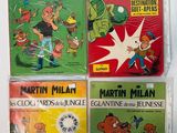 four children ' s comic books are lined up on a white surface