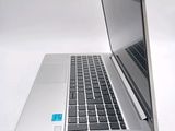 a close up of a laptop computer on a white surface
