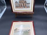 two framed pictures of a building and a painting on a easel