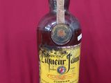 an image of a bottle of liquor sitting on a table
