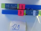 two skis that are on a table with a price tag