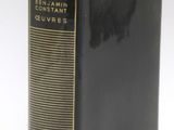 a close up of a book on a white surface