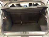 the back of a car with its trunk open and the back seats folded down