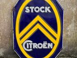 a blue and yellow sign that says stock citroen on it