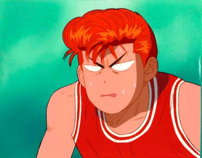 une photo d'un homme aux cheveux roux portant un maillot de basket rouge