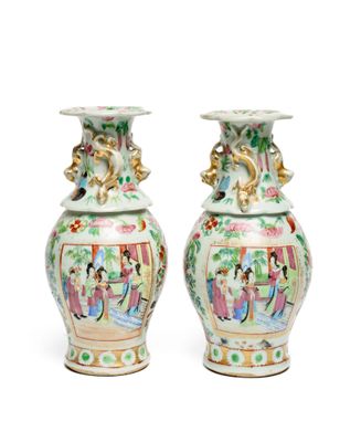 pair of chinese vases on a white background with a white background