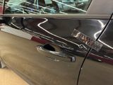 a close up of a car door handle with a sticker on it