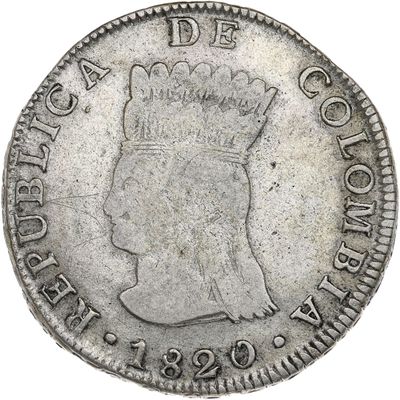 a close up of a silver coin with a crown on it