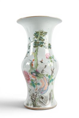 a white vase with a painting of birds and flowers on it