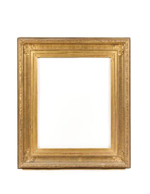a gold frame on a white wall with a white background