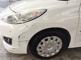 a white car that is parked in a garage