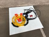 a yellow hose and a black hose on a white piece of paper