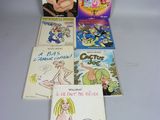 six livres pour enfants sont alignés sur une surface blanche