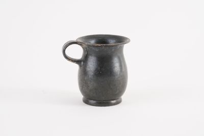 an image of a black cup with a handle on a white background
