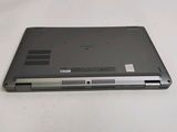 a laptop that is sitting on a white table