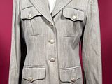 an image of a woman ' s jacket on a mannequin