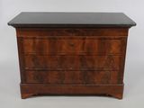 an antique chest of drawers with a marble top