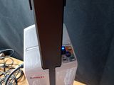 a video game system sitting on top of a wooden table