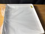 a plastic tray that is sitting on a wooden table