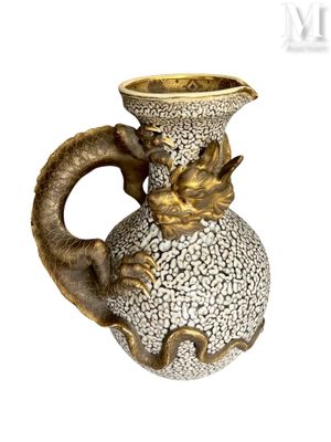 an image of a vase with a dragon head on it